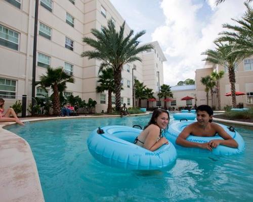 Photo of students enjoying the lazy river pool